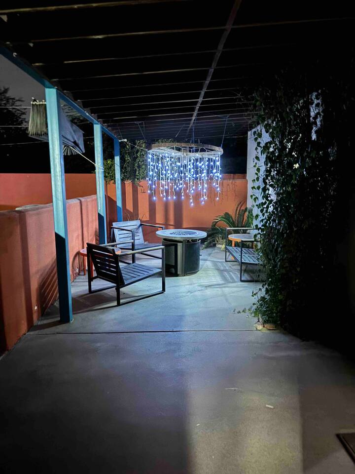 A patio with chairs and tables in it