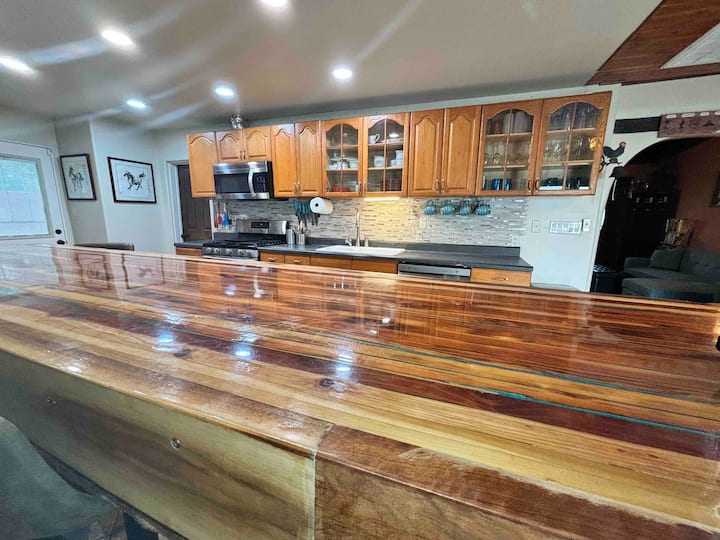A kitchen with wooden counters and cabinets